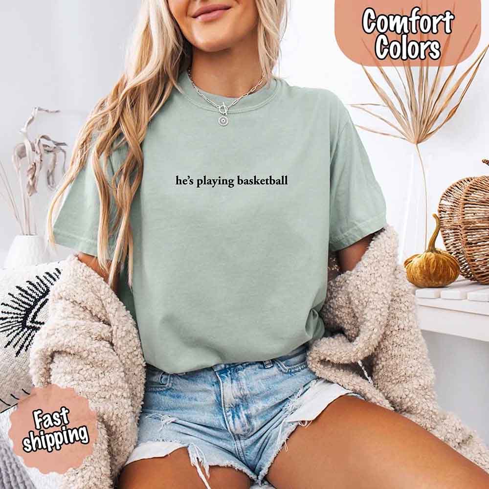 He’s Playing Basketball – Funny Sports Girlfriend Comfort Color Shirt for Women